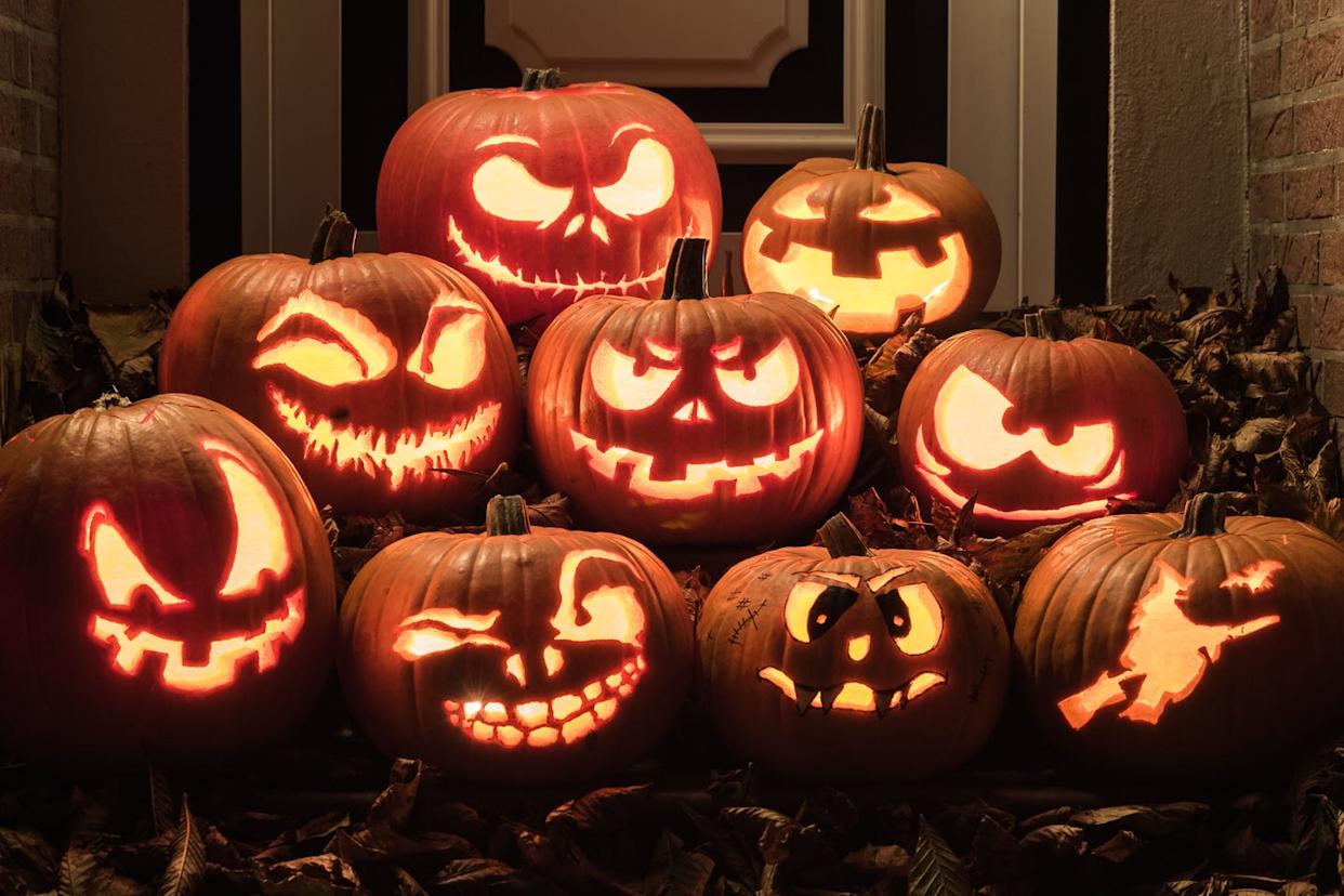 Halloween pumpkins lining a neighborhood street — a snapshot of community festivities.