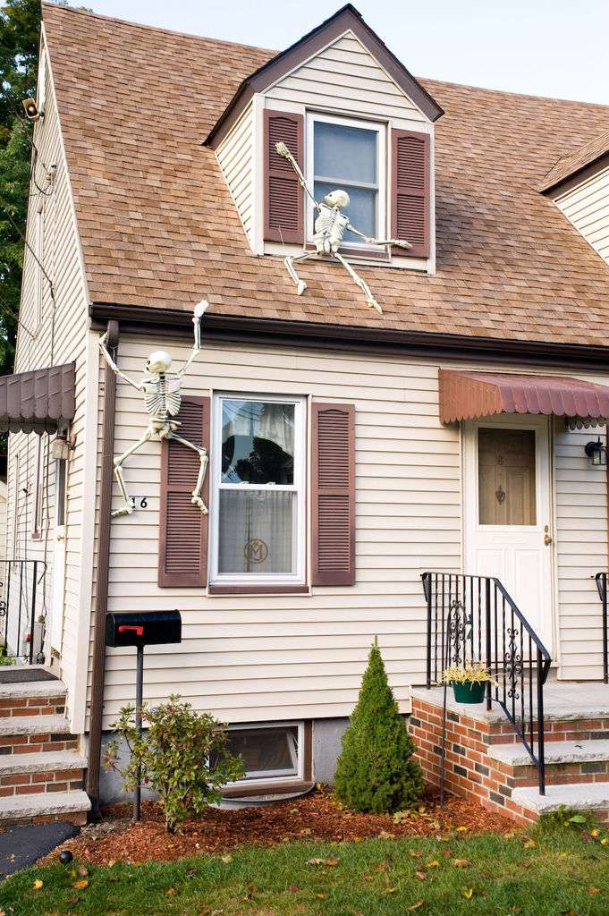 A climbing skeleton prop for high-impact, animated Halloween displays.